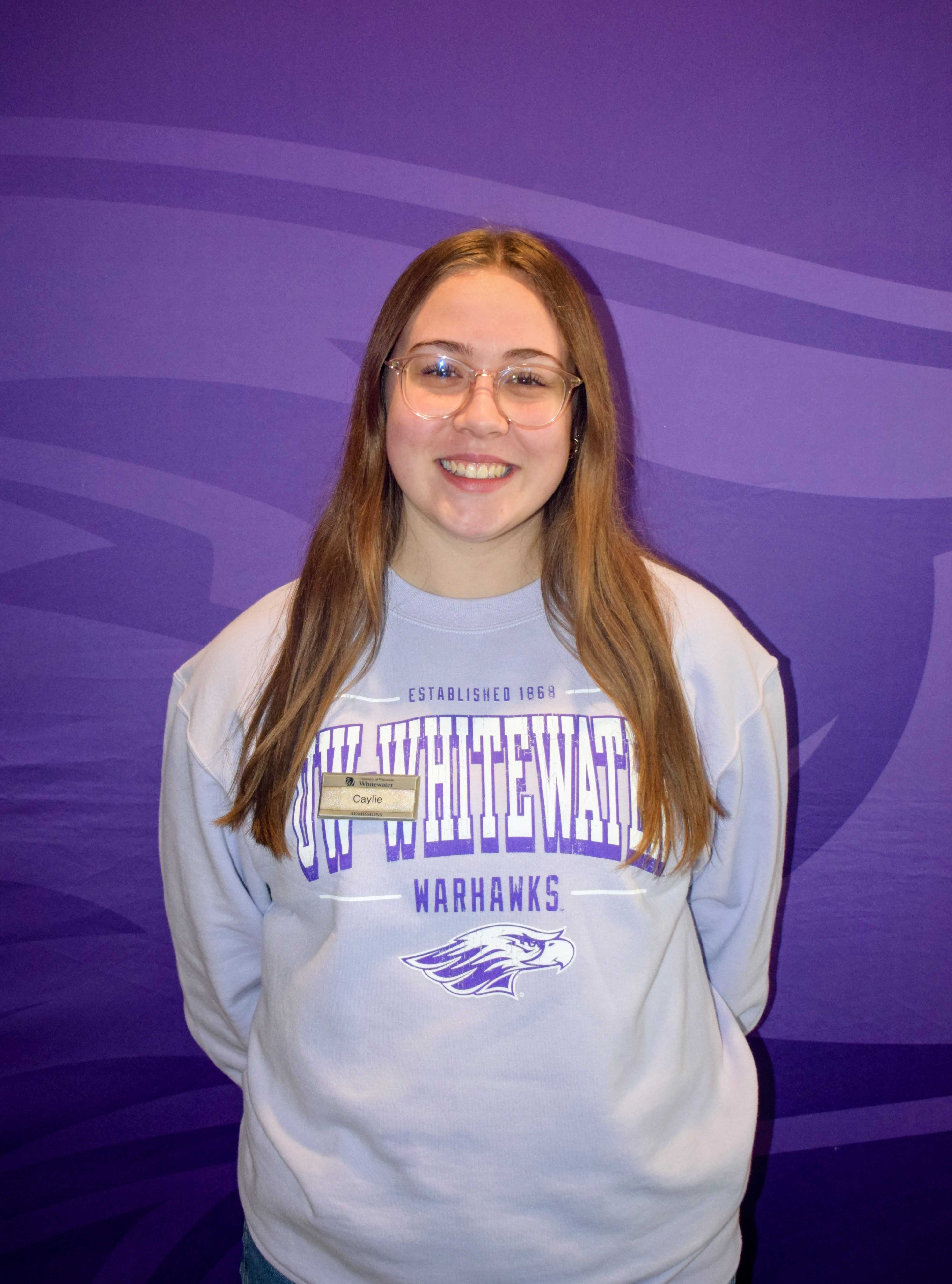 A headshot of Caylie